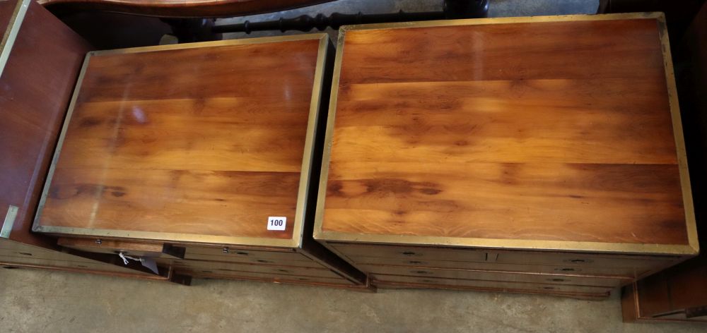 A pair of brass mounted yew wood campaign style chests, each with brushing slide, two short and three graduated long drawers, width 56c